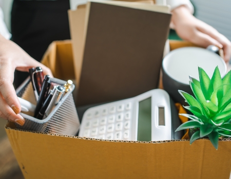 Business woman sending resignation letter and packing Stuff Resi