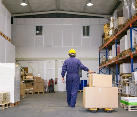 Senior logistic worker in hardhat and uniform